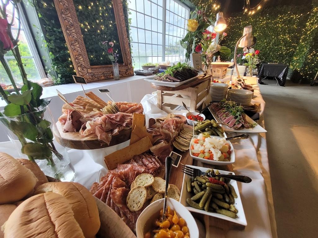 Elegant charcuterie buffet with floral decor