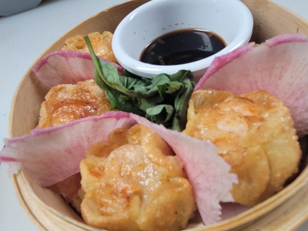 Dim sum dumplings with soy sauce dip