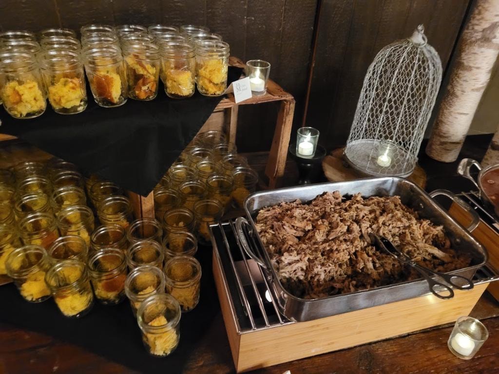 Catered food display with jars and meat