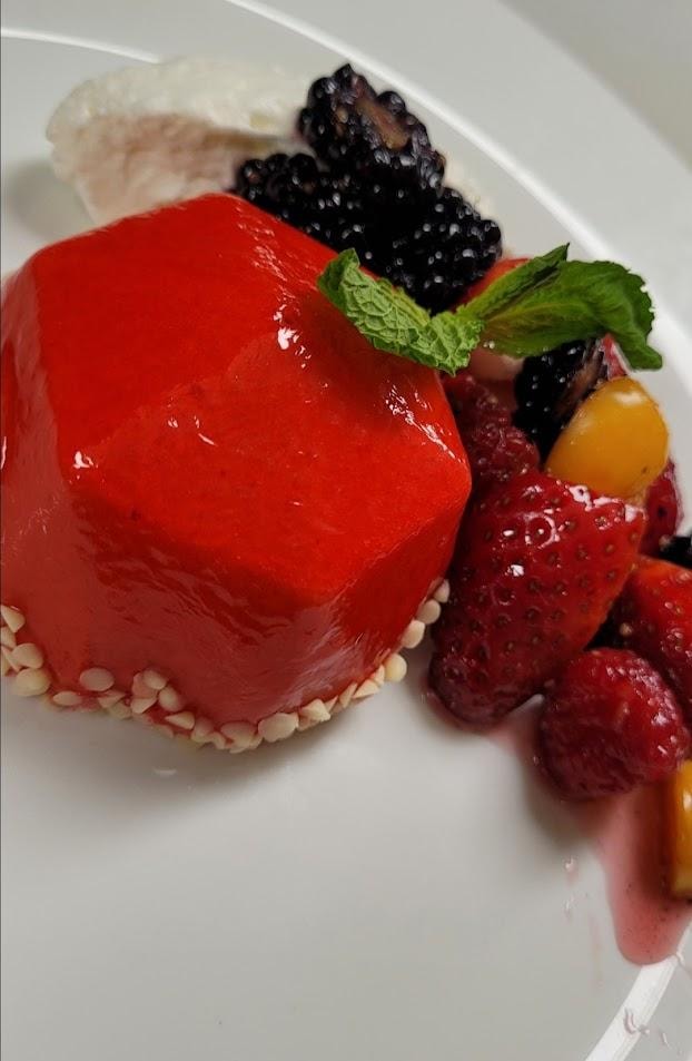 Gourmet dessert with berries and mint garnish