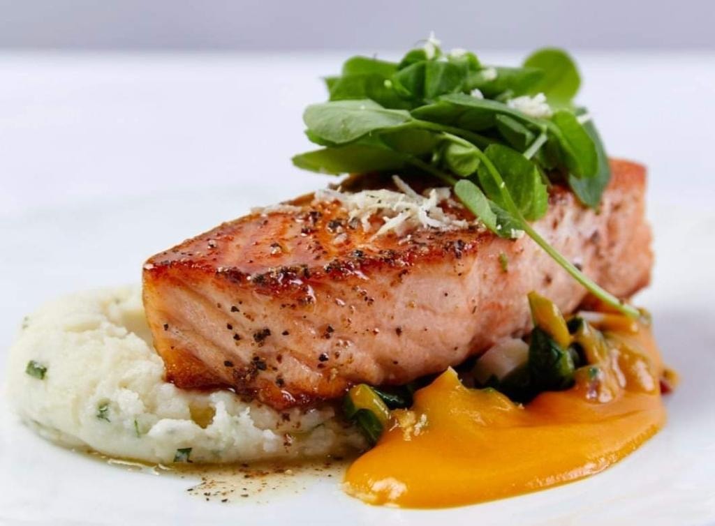 Seared salmon with mashed potatoes and greens