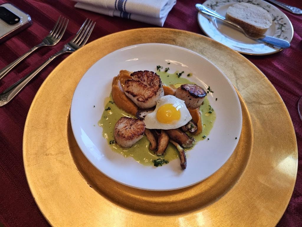 Seared scallops with mushrooms and quail egg