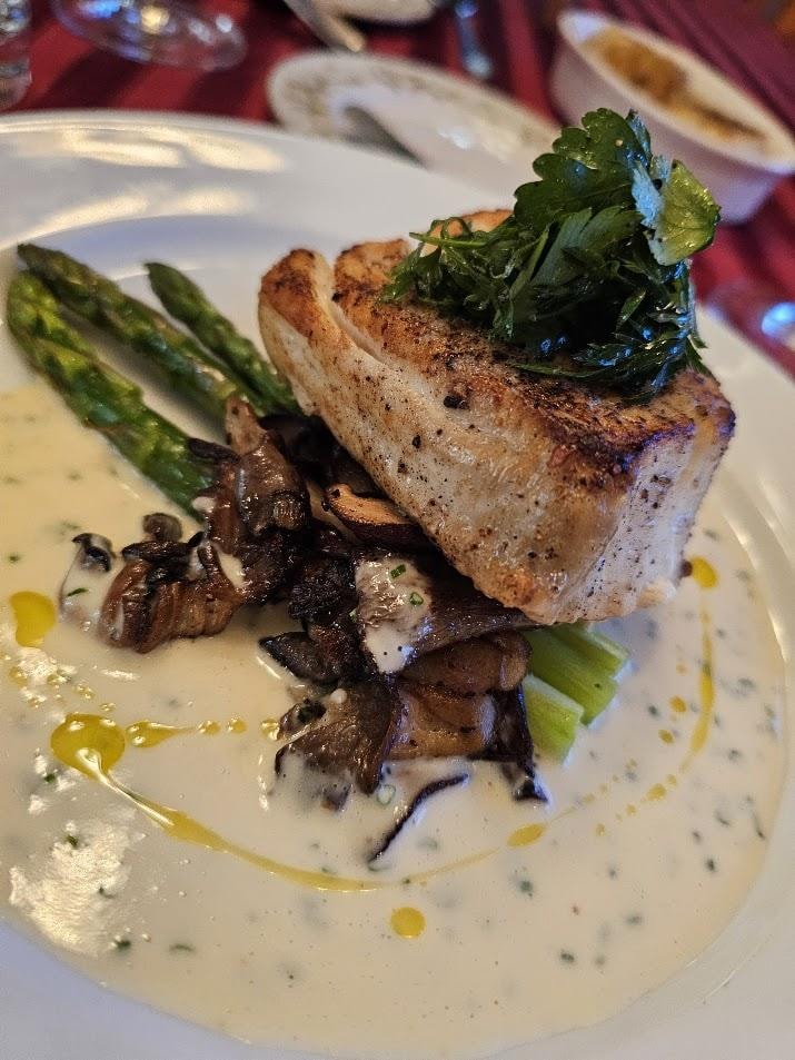 Seared fish with asparagus, mushrooms, and herbs
