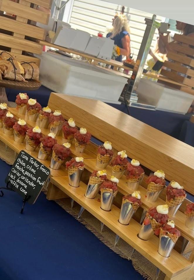 Gourmet taco cups displayed on wooden counter