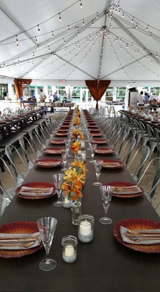 Elegant banquet tent with long dining table