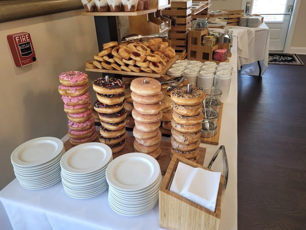Donut and pastry station set for a catered breakfast