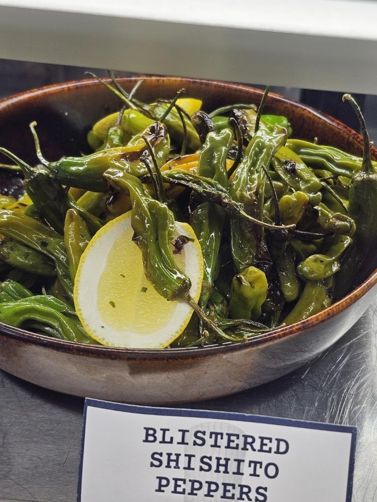Cornerstone blistered shishito peppers with lemon