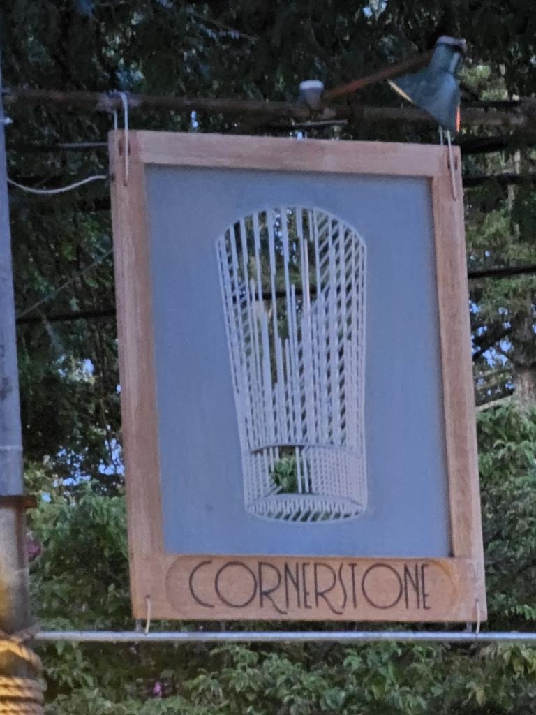 Cornerstone sign with birdcage illustration