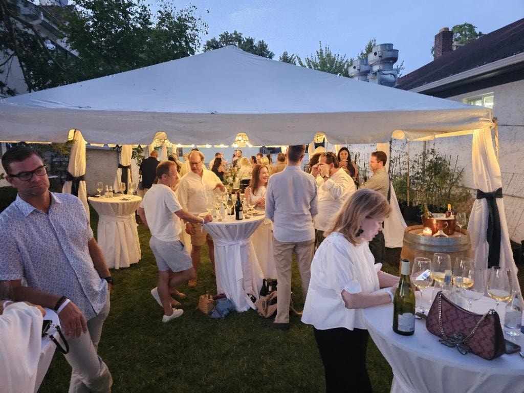 Cornerstone outdoor evening event under a white tent
