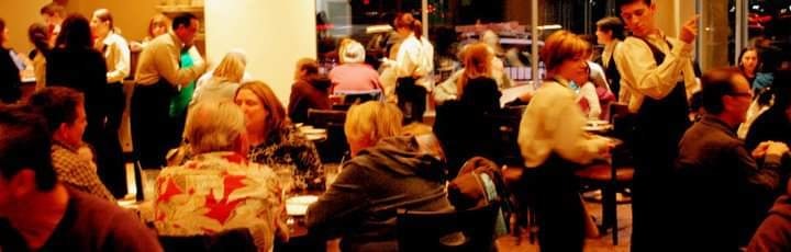 Crowded indoor event with people mingling