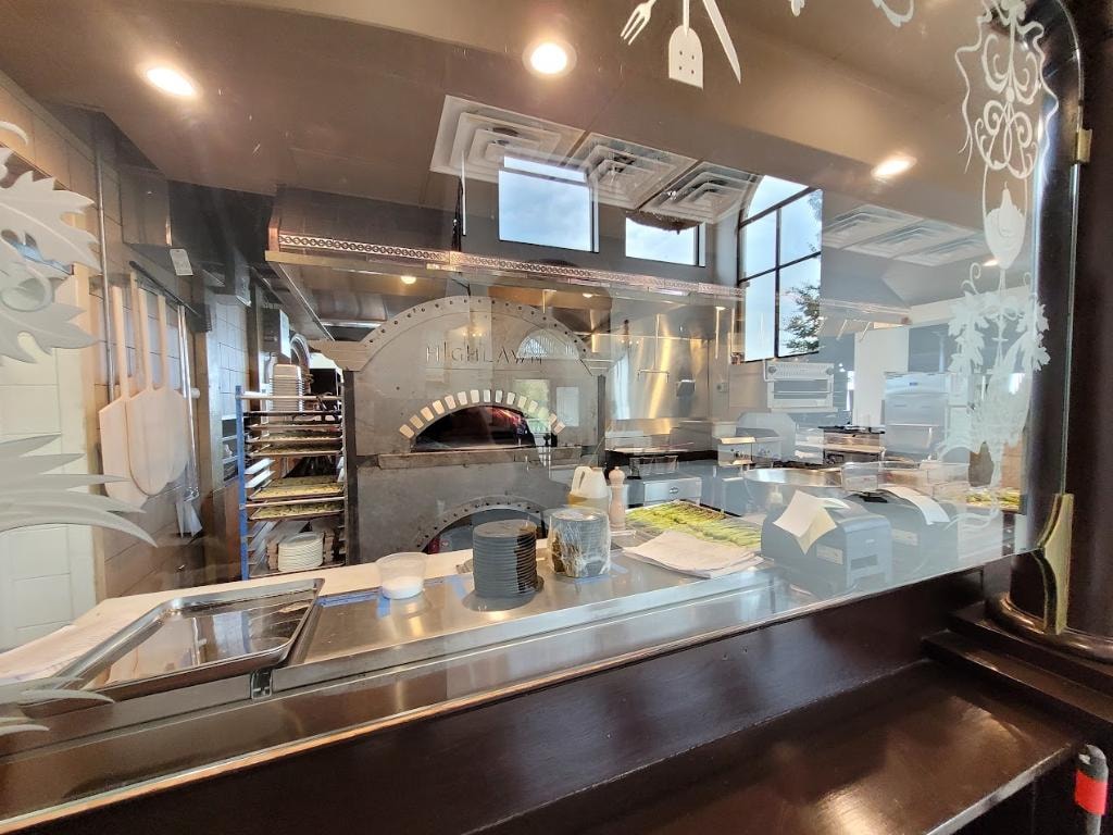 Modern pizza restaurant open kitchen counter