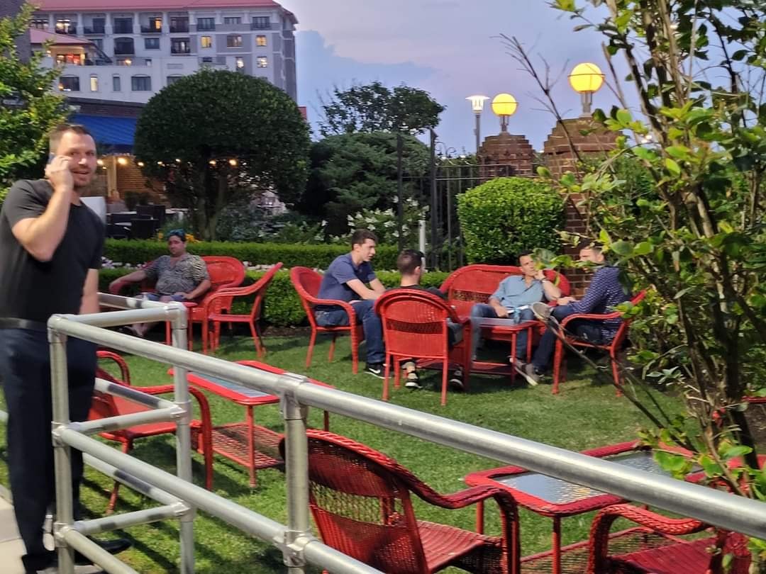 People gathering in urban garden seating area