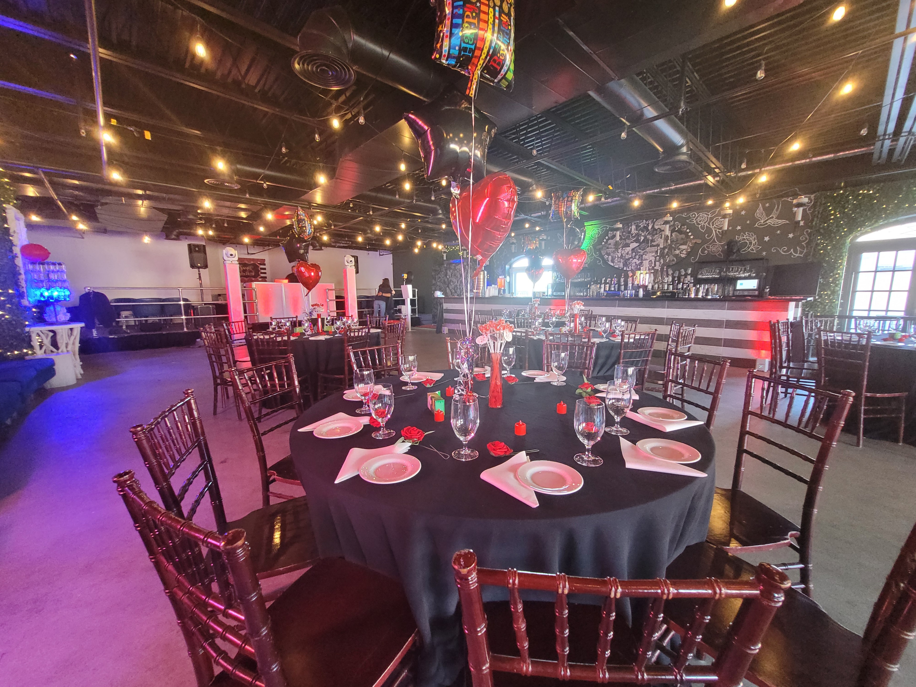 Johnny and June event space with heart balloons and bar in background