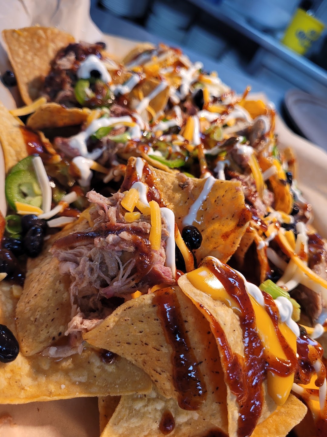 Loaded nachos with shredded meat toppings