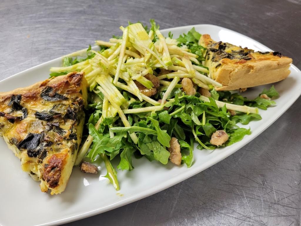 Johnny and June savory quiche served with fresh salad