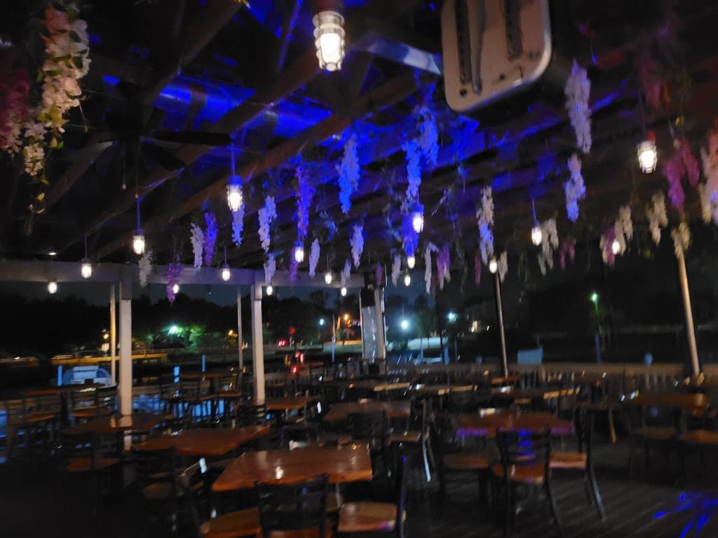 Oceanport Marina evening event with blue lighting and floral installations