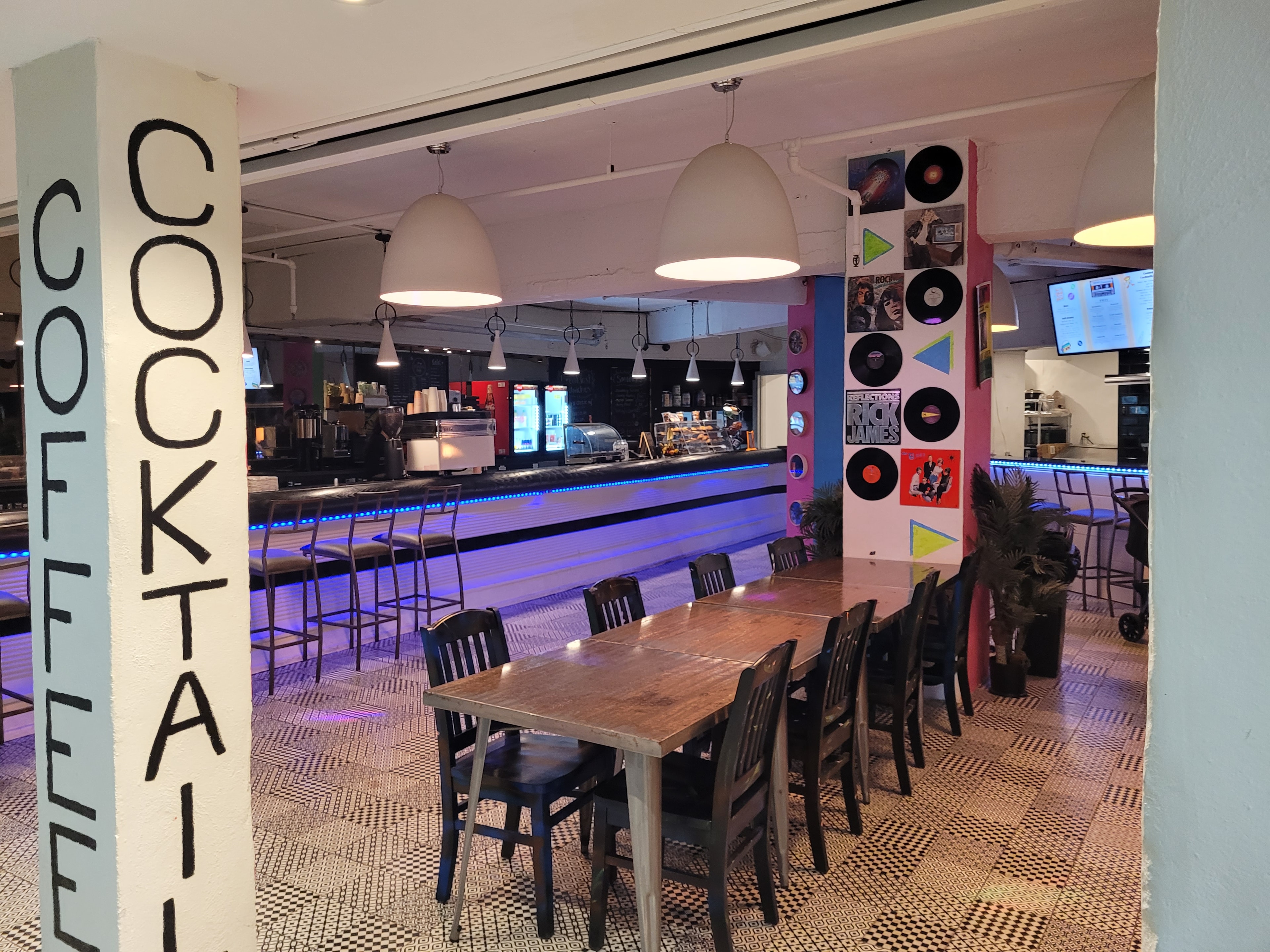 Rewind Pizzarama bar and dining room with blue neon lighting