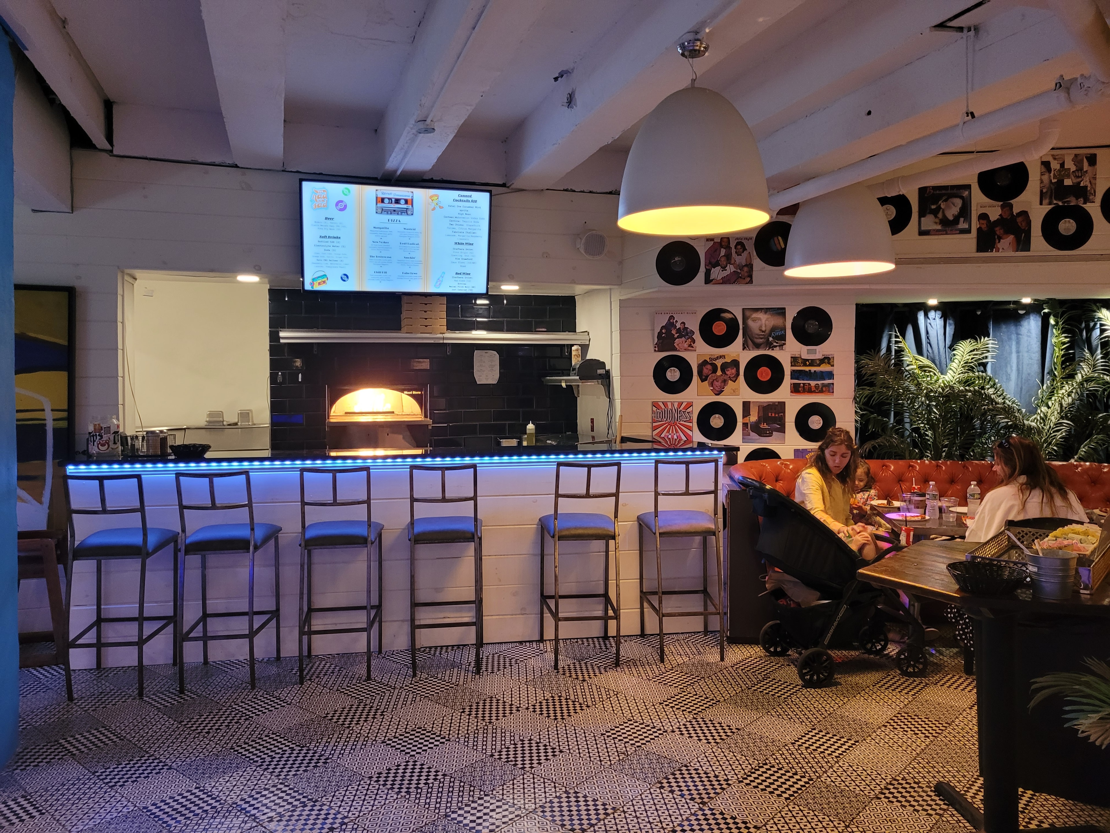 Rewind Pizzarama pizza oven bar with blue LED counter and vinyl record wall