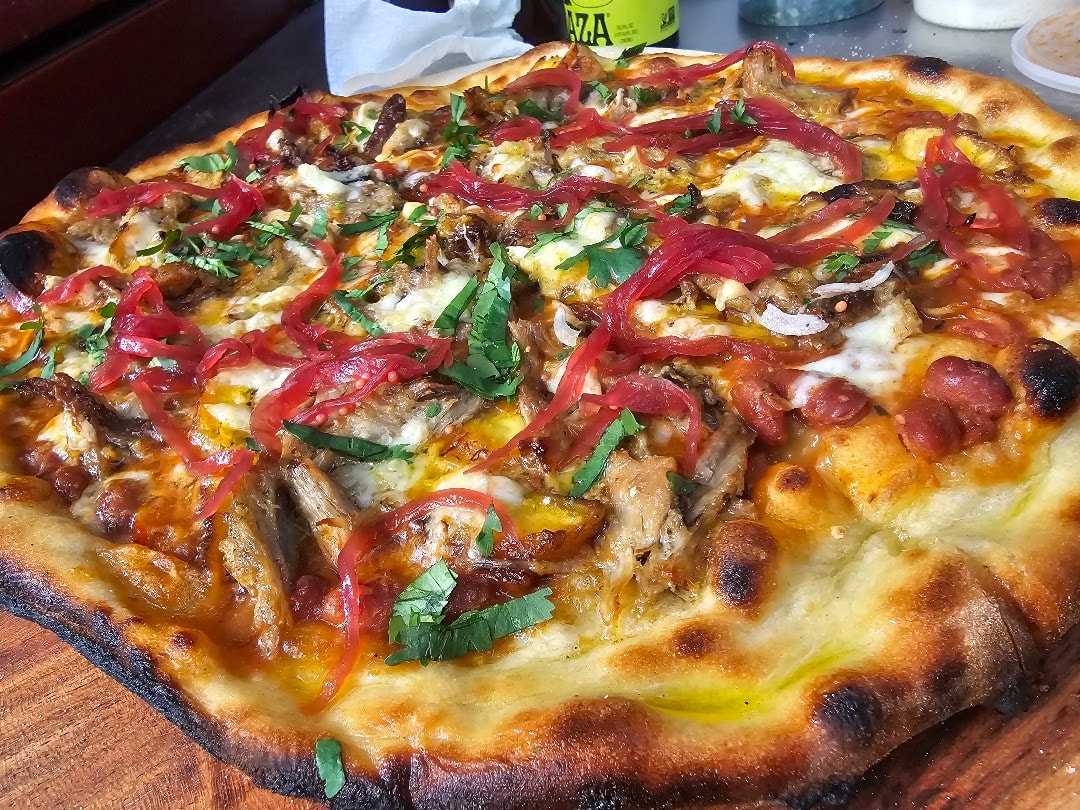 Loaded pizza with peppers and meat